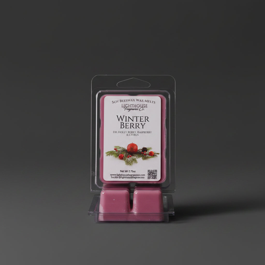 Packaged wax melts labeled 'Winter Berry' next to a wax warmer on a wooden surface.