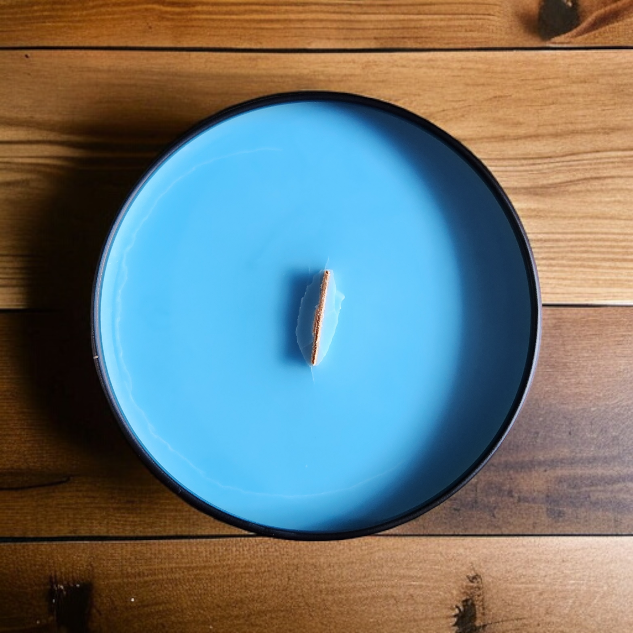 Blue Candle in a Black Tin